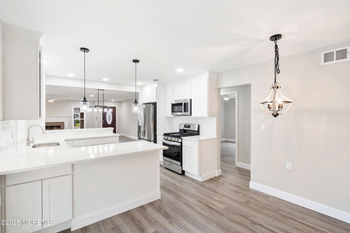 Interior, Kitchen, Pendant Lights, Recessed Lighting, Stainless Steel Appliances, Wood Texture Flooring