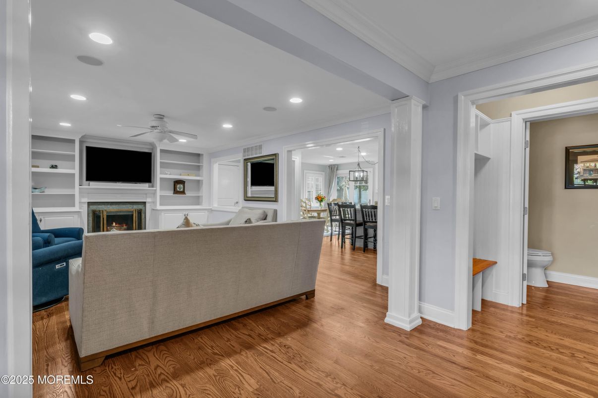Dining room, Fireplace, Interior, Living room, Pendant Lights, Recessed Lighting, Wood Texture Flooring