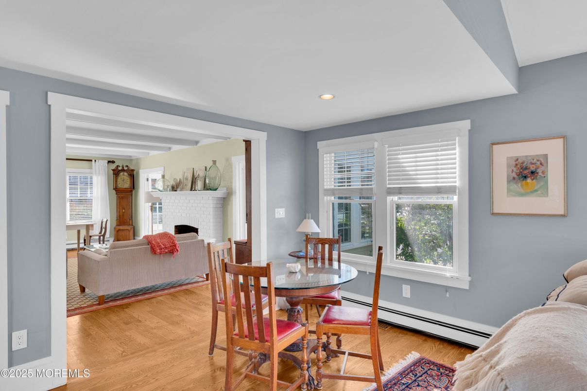 Dining room, Fireplace, Interior, Living room, Recessed Lighting, Wood Texture Flooring