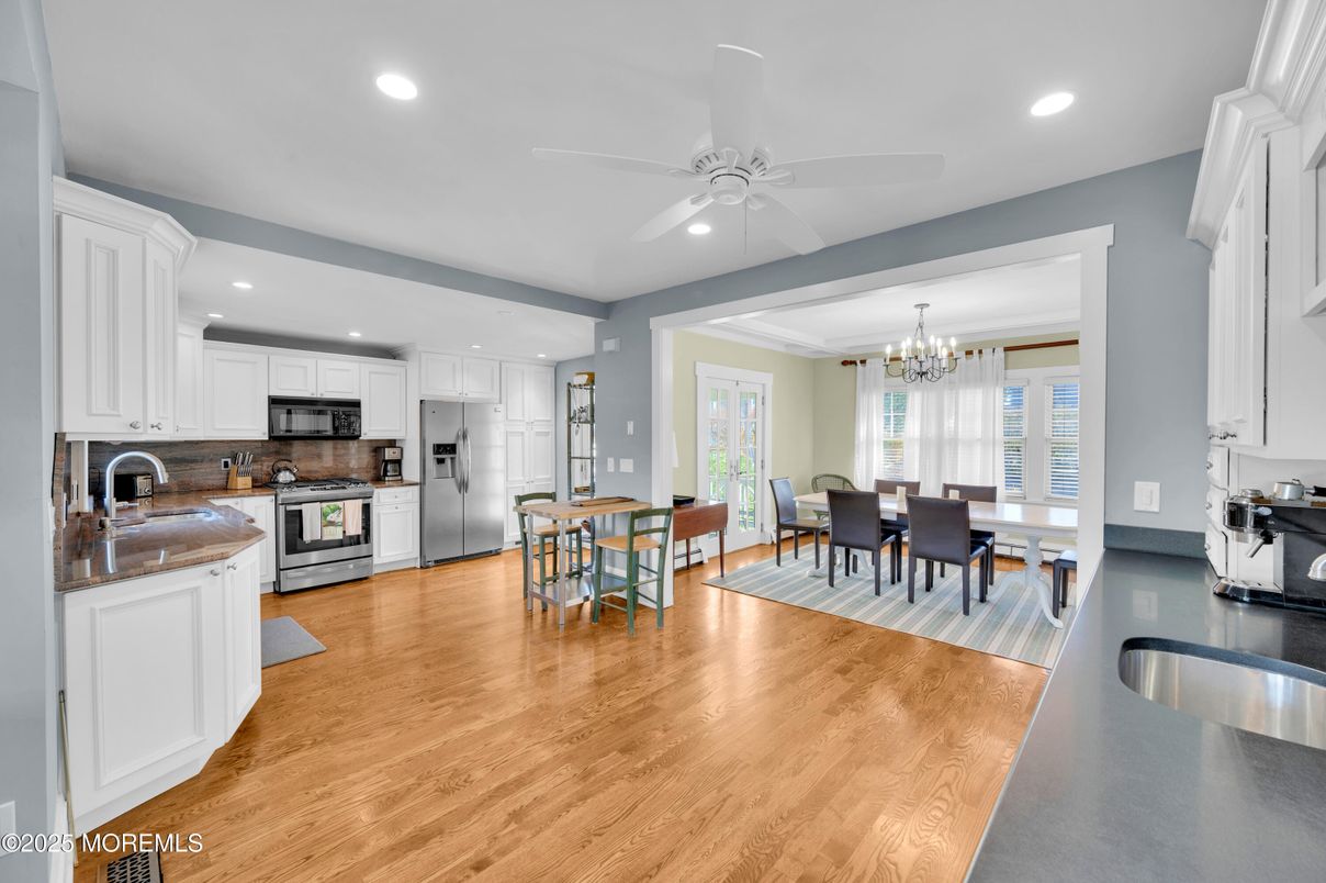 Chandelier, Dining room, Interior, Kitchen, Recessed Lighting, Stainless Steel Appliances, Wood Texture Flooring