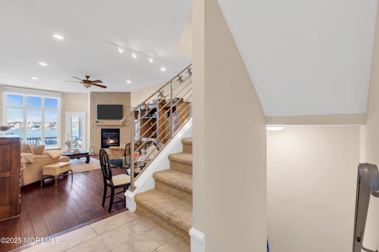 Fireplace, Interior, Living room, Recessed Lighting, Water, Wood Texture Flooring