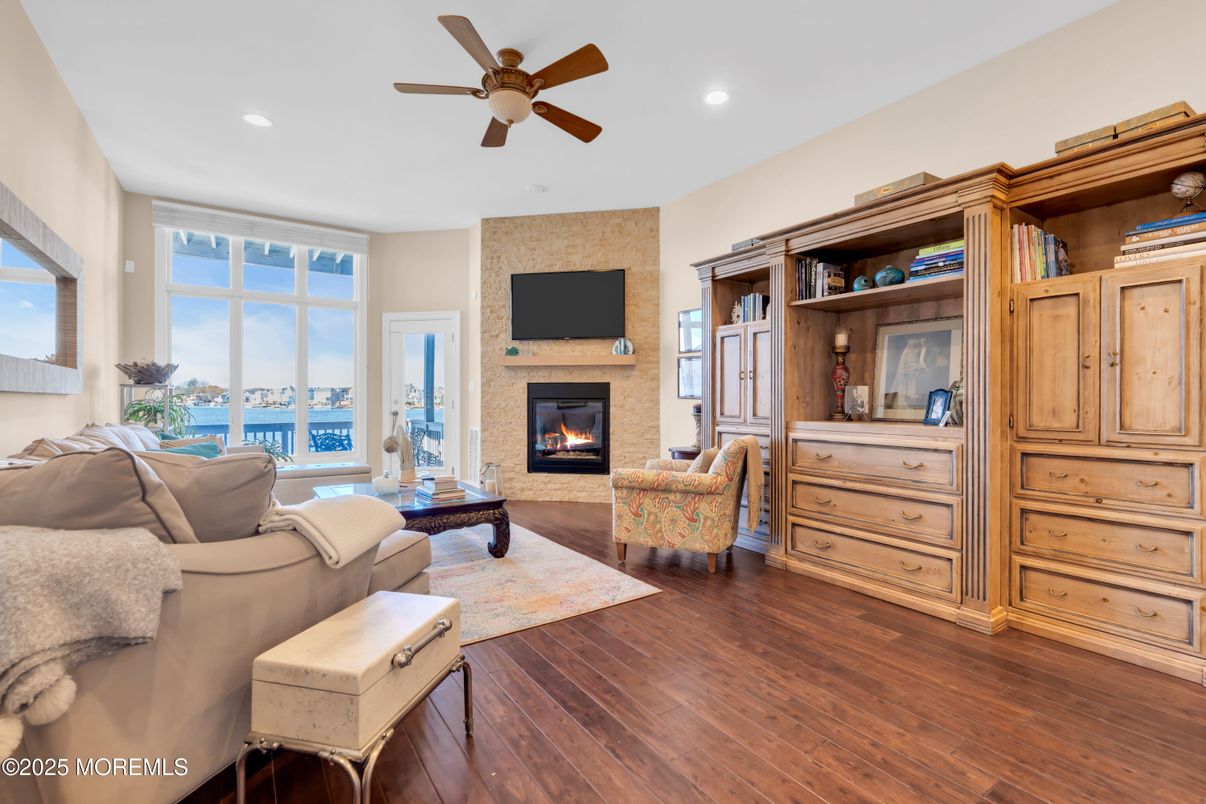 Fireplace, Interior, Living room, Recessed Lighting, Water, Wood Texture Flooring