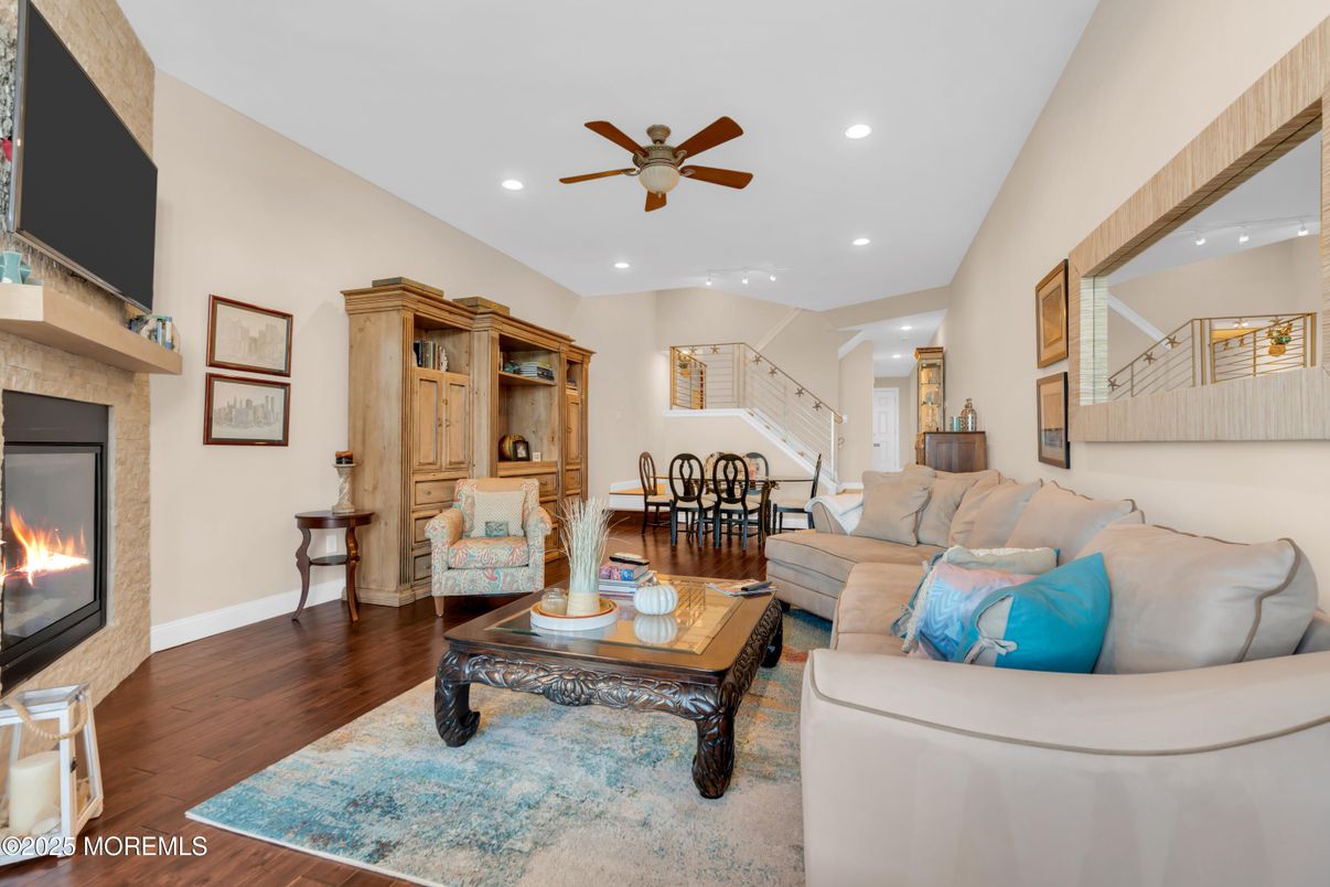 Dining room, Fireplace, Interior, Living room, Recessed Lighting, Wood Texture Flooring