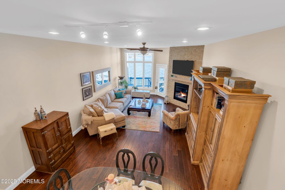 Dining room, Fireplace, Interior, Living room, Recessed Lighting, Wood Texture Flooring