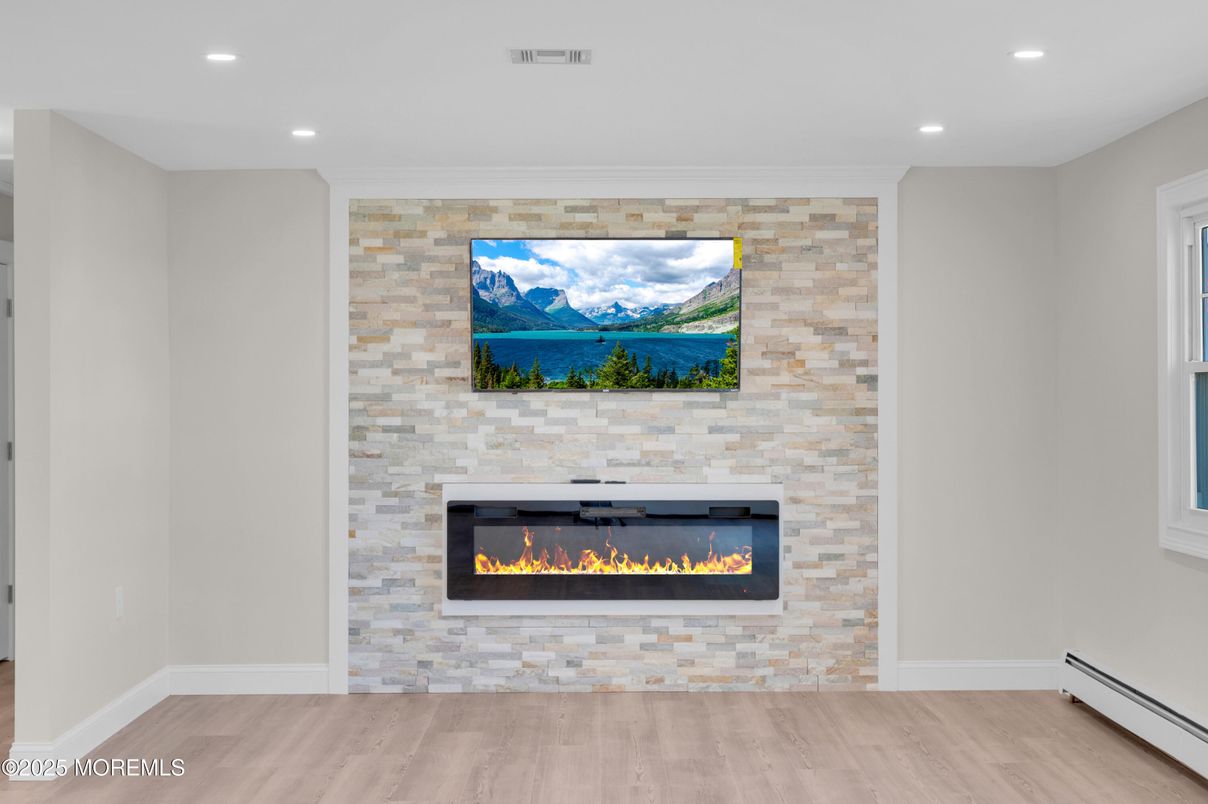 Empty room, Fireplace, Interior, Recessed Lighting, Stone Walls, Wood Texture Flooring