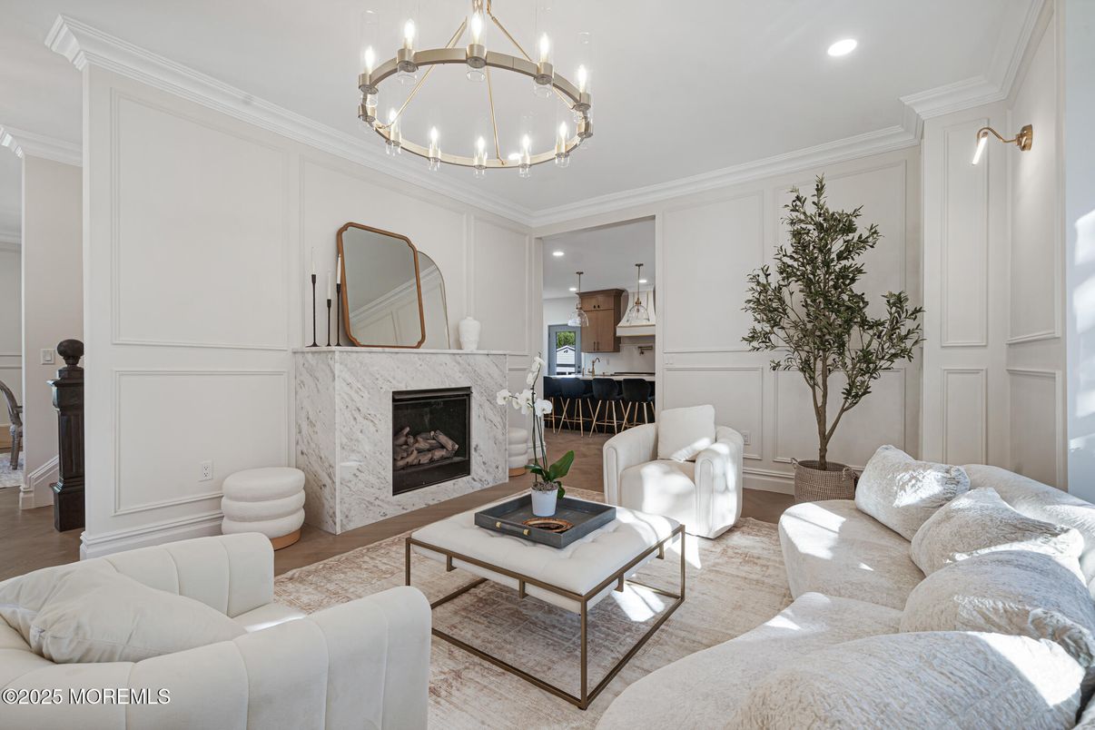 Chandelier, Fireplace, Interior, Living room, Pendant Lights, Recessed Lighting, Wood Texture Flooring