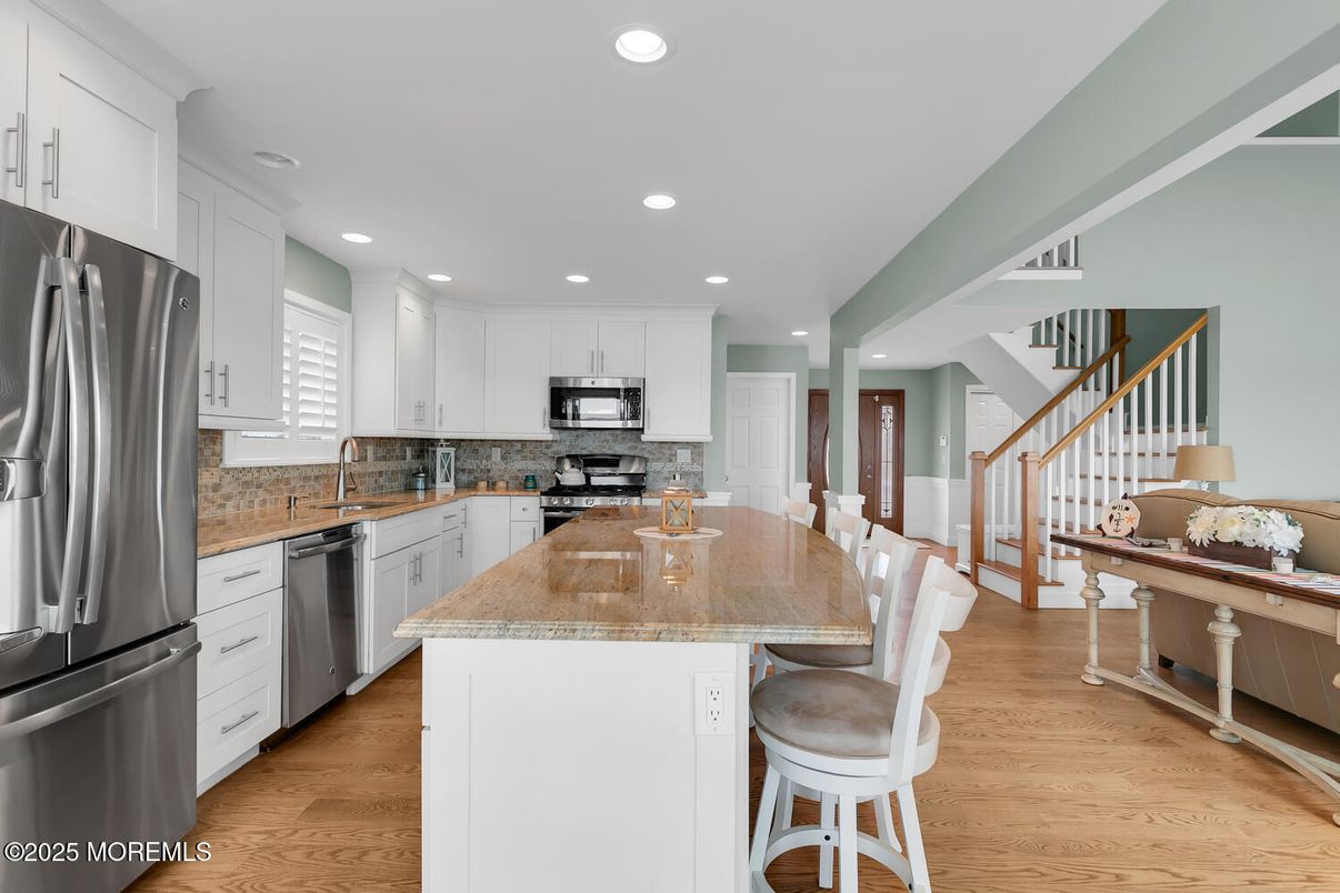 Dining room, Interior, Kitchen, Recessed Lighting, Stainless Steel Appliances, Wood Texture Flooring