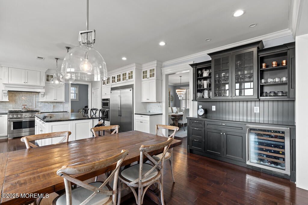 Dining room, Interior, Kitchen, Pendant Lights, Recessed Lighting, Stainless Steel Appliances, Wood Texture Flooring