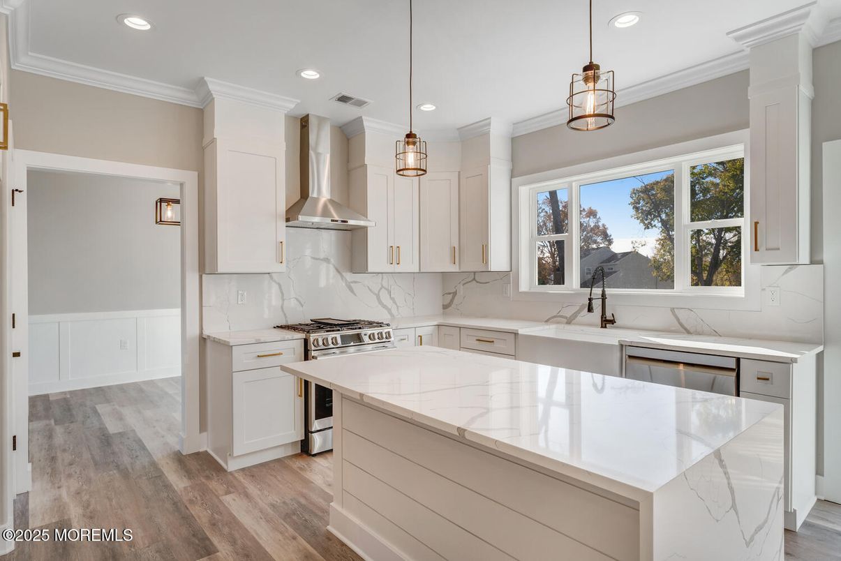 Interior, Kitchen, Marble Walls, Pendant Lights, Recessed Lighting, Stainless Steel Appliances, Wood Texture Flooring