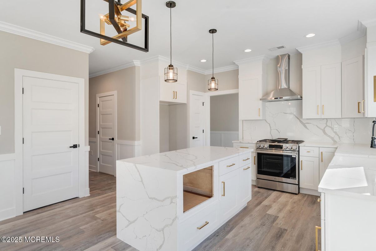 Interior, Kitchen, Marble Walls, Pendant Lights, Recessed Lighting, Stainless Steel Appliances, Wood Texture Flooring