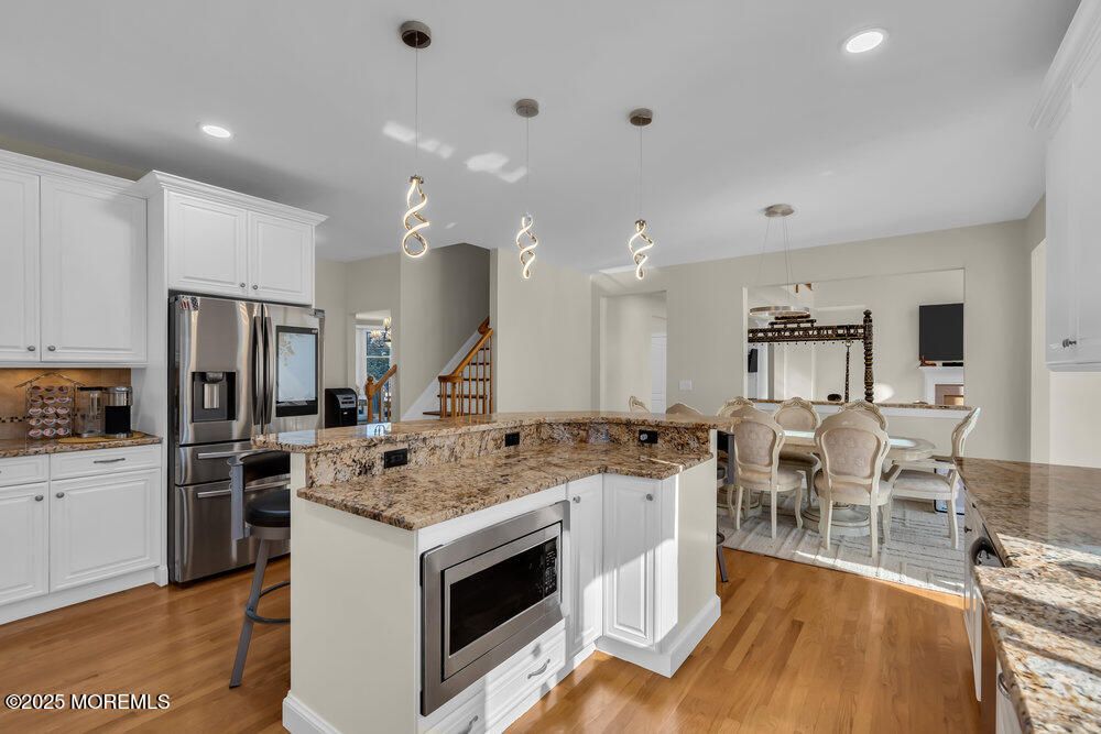 Dining room, Interior, Kitchen, Pendant Lights, Recessed Lighting, Stainless Steel Appliances, Wood Texture Flooring