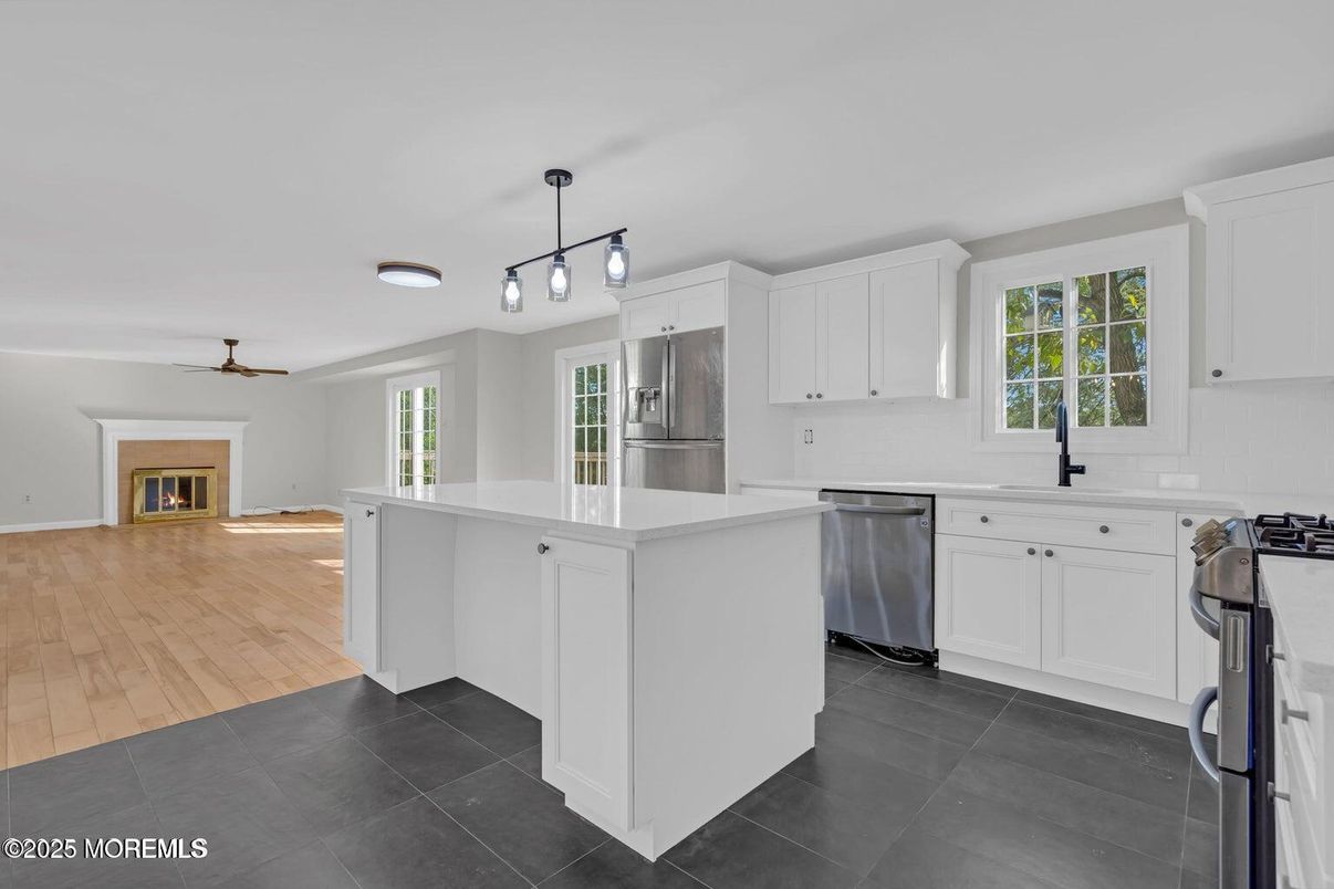 Fireplace, Interior, Kitchen, Pendant Lights, Stainless Steel Appliances, Wood Texture Flooring