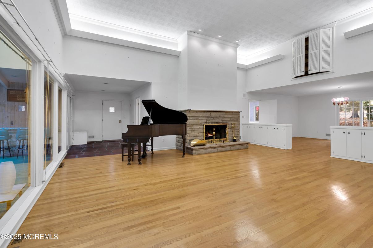 Chandelier, Fireplace, Interior, Piano, Recessed Lighting, Wood Texture Flooring