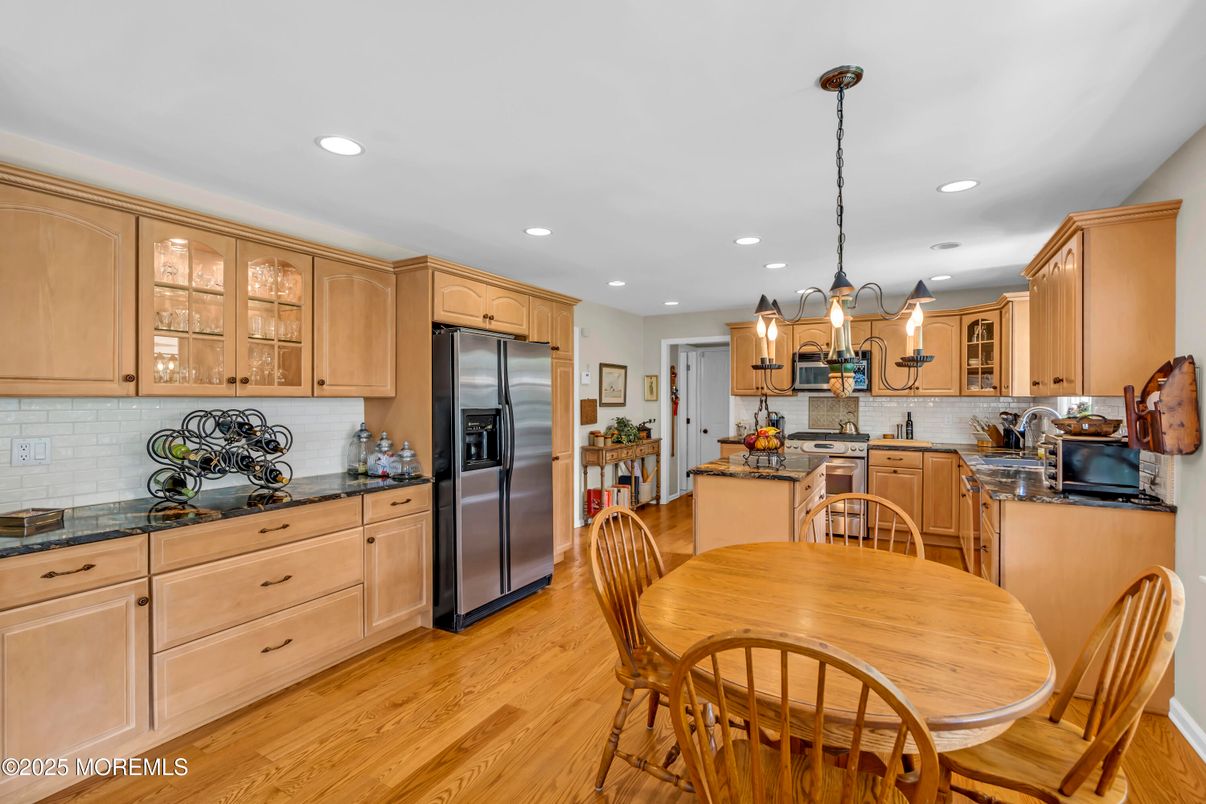 Dining room, Interior, Kitchen, Pendant Lights, Recessed Lighting, Stainless Steel Appliances, Wood Texture Flooring