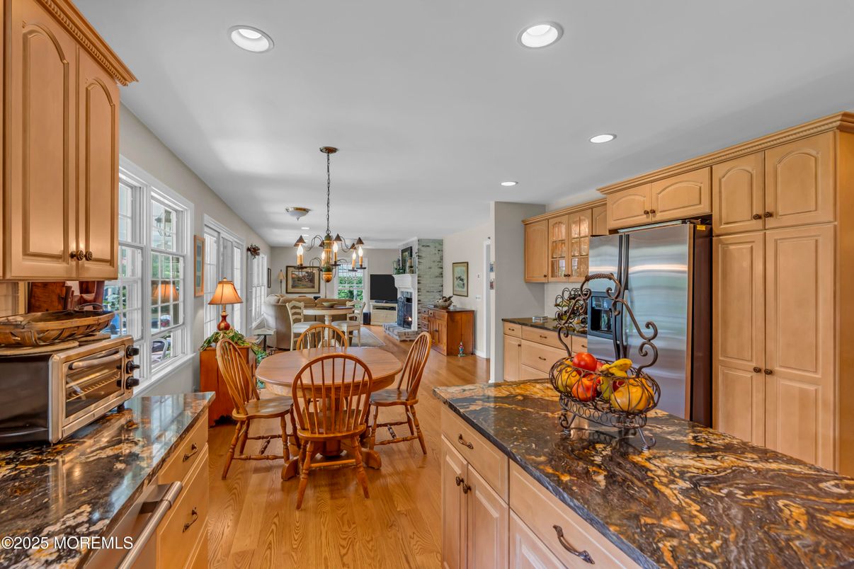 Chandelier, Dining room, Interior, Kitchen, Pendant Lights, Recessed Lighting, Stainless Steel Appliances, Wood Texture Flooring