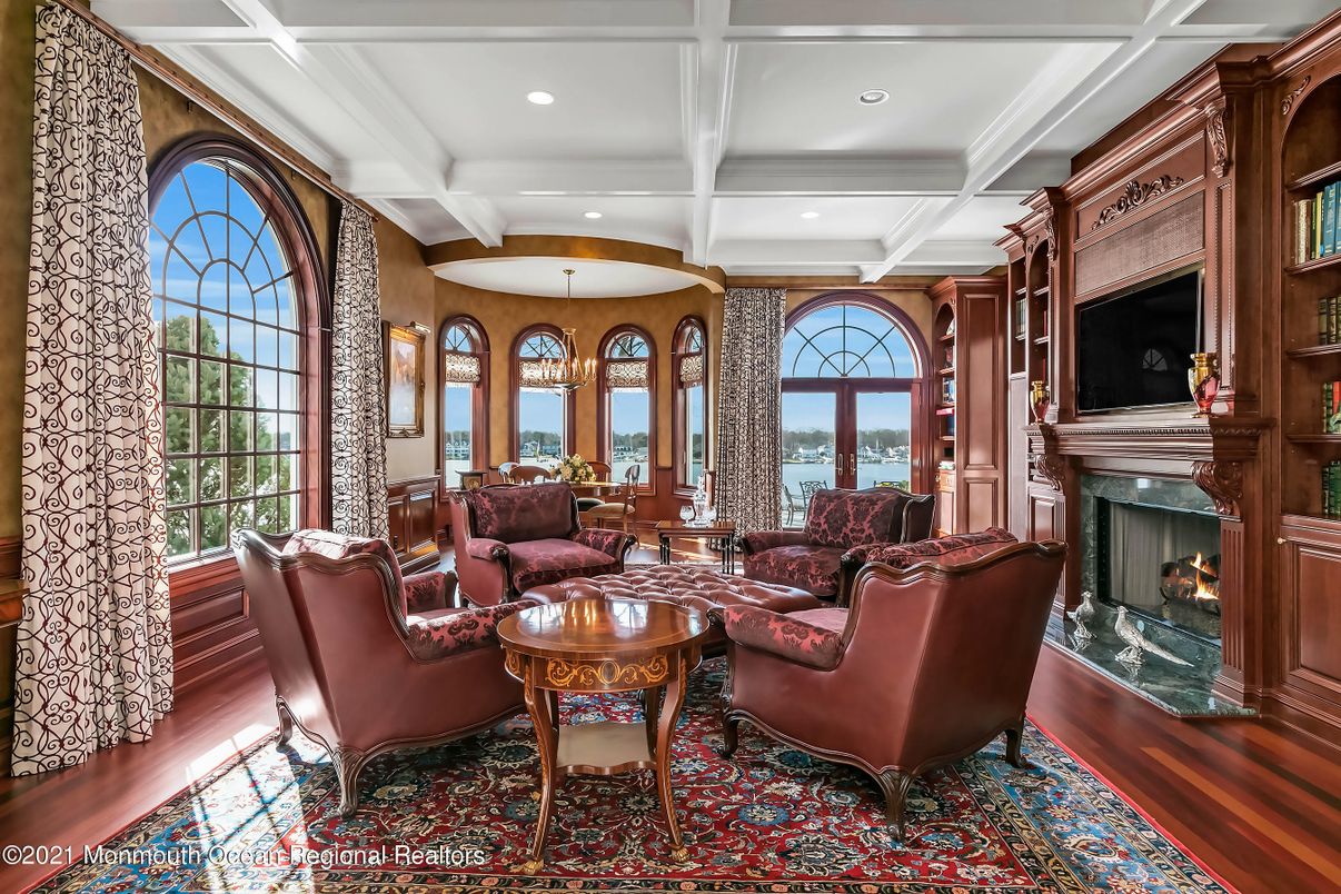 Chandelier, Fireplace, Interior, Living room, Recessed Lighting, Water, Wood Texture Flooring