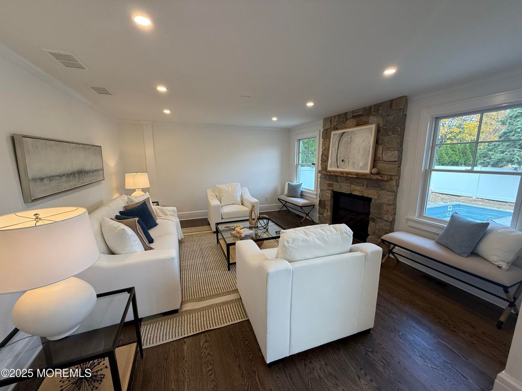 Fireplace, Interior, Living room, Recessed Lighting, Stone Walls, Wood Texture Flooring