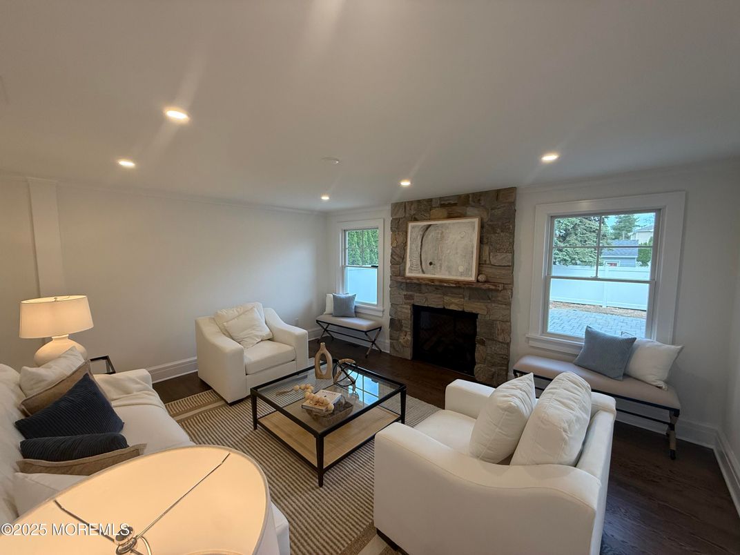 Fireplace, Interior, Living room, Recessed Lighting, Stone Walls, Wood Texture Flooring