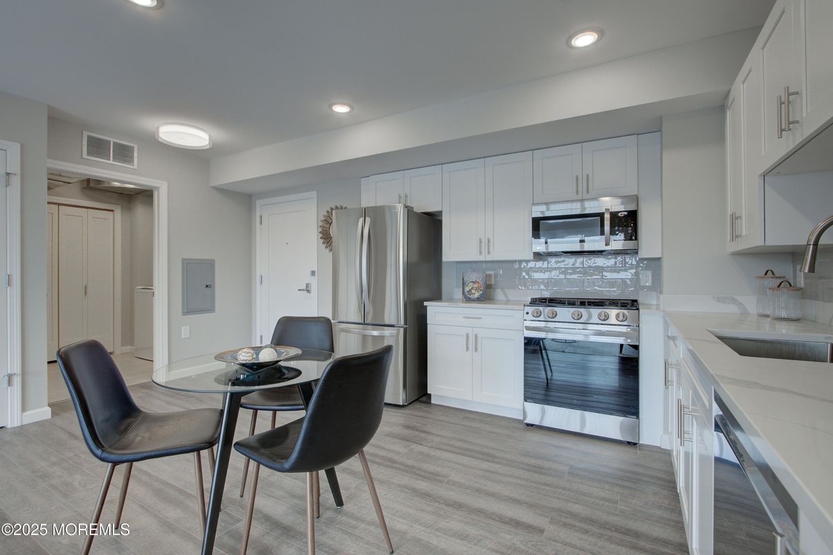 Dining room, Interior, Kitchen, Recessed Lighting, Stainless Steel Appliances, Wood Texture Flooring