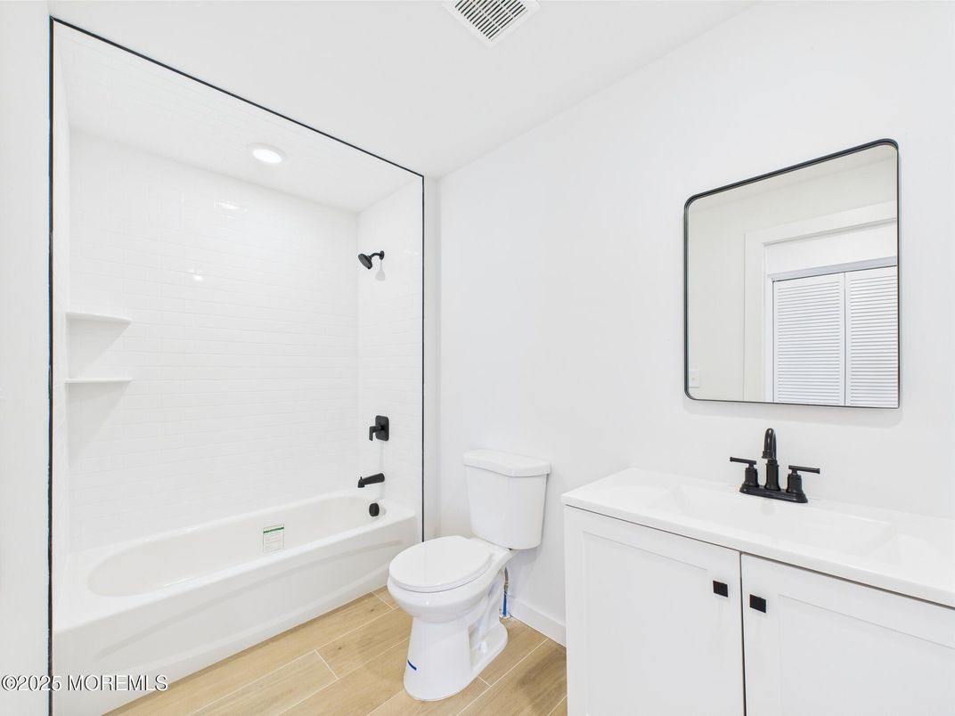 Bathroom, Dual Sink Vanities, Interior, Recessed Lighting, Wood Texture Flooring