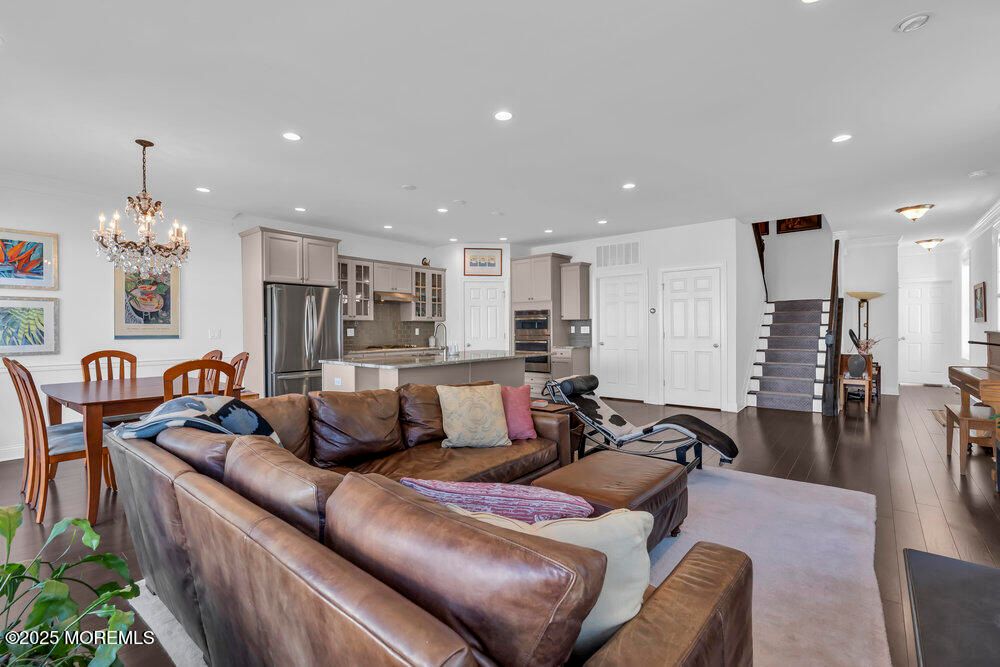 Chandelier, Dining room, Interior, Kitchen, Living room, Recessed Lighting, Stainless Steel Appliances, Wood Texture Flooring