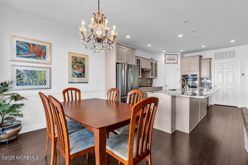 Chandelier, Dining room, Interior, Kitchen, Recessed Lighting, Stainless Steel Appliances, Wood Texture Flooring