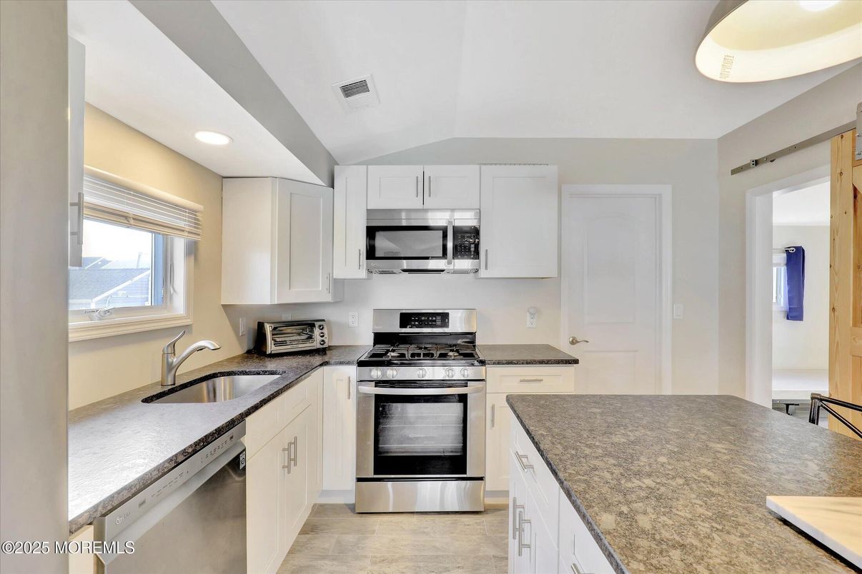 Interior, Kitchen, Recessed Lighting, Stainless Steel Appliances, Wood Texture Flooring