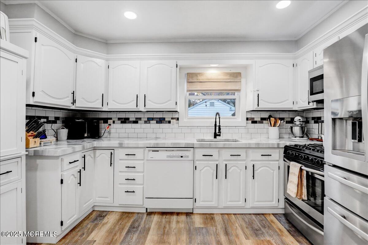 Interior, Kitchen, Recessed Lighting, Stainless Steel Appliances, Tile Countertops, Wood Texture Flooring