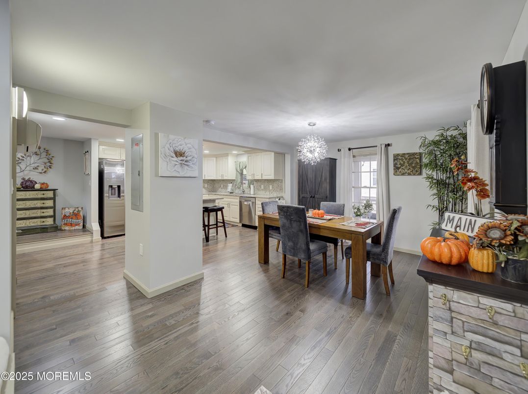 Chandelier, Dining room, Interior, Kitchen, Recessed Lighting, Stainless Steel Appliances, Wood Texture Flooring