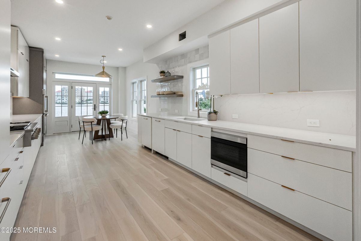 Dining room, Interior, Kitchen, Pendant Lights, Recessed Lighting, Stainless Steel Appliances, Wood Texture Flooring