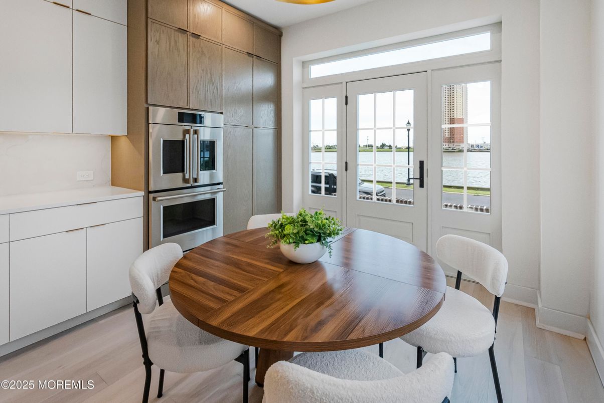 Dining room, Interior, Kitchen, Pendant Lights, Stainless Steel Appliances, Water, Wood Texture Flooring