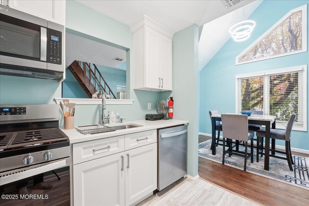Dining room, Interior, Kitchen, Pendant Lights, Stainless Steel Appliances, Wood Texture Flooring