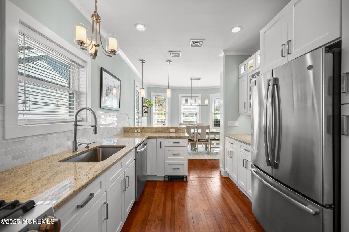 Dining room, Interior, Kitchen, Pendant Lights, Recessed Lighting, Stainless Steel Appliances, Wood Texture Flooring