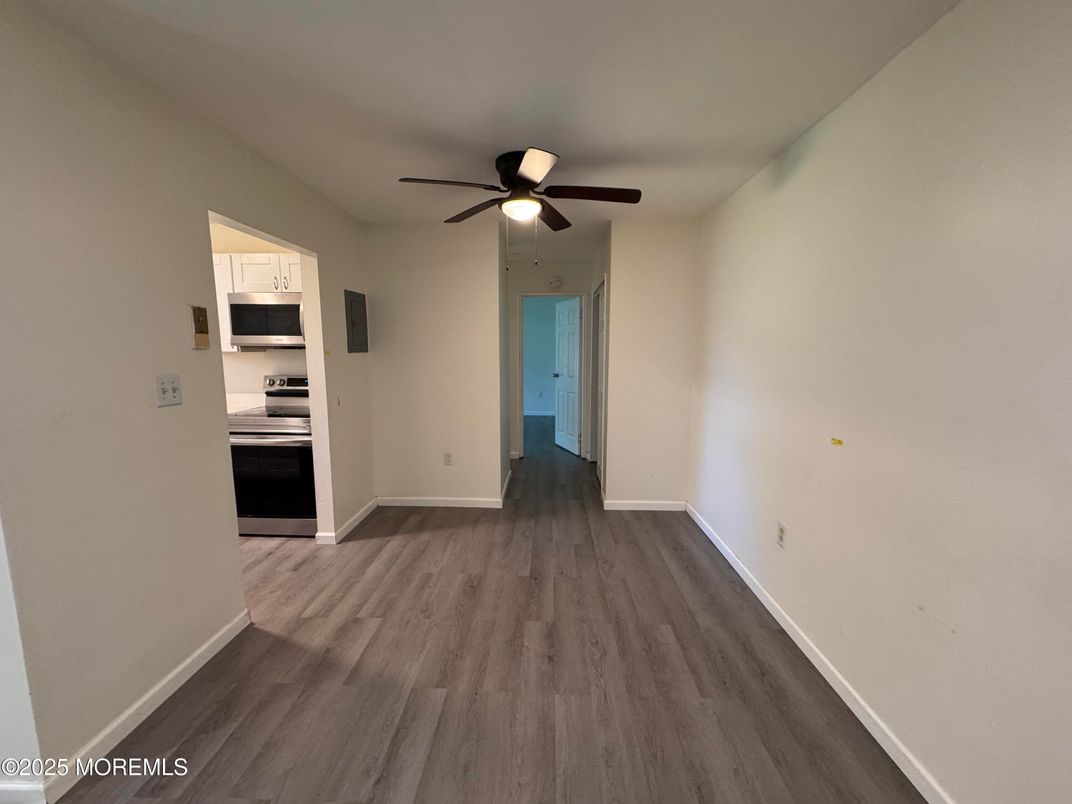 Empty room, Interior, Kitchen, Stainless Steel Appliances, Wood Texture Flooring