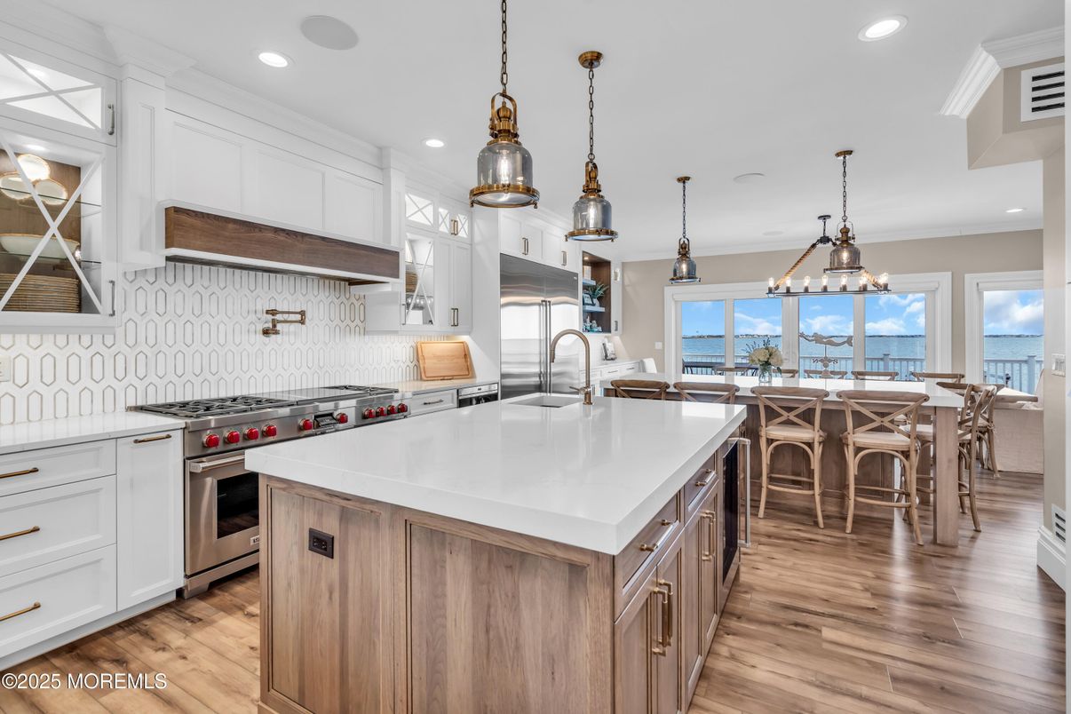 Dining room, Interior, Kitchen, Pendant Lights, Recessed Lighting, Stainless Steel Appliances, Water, Wood Texture Flooring