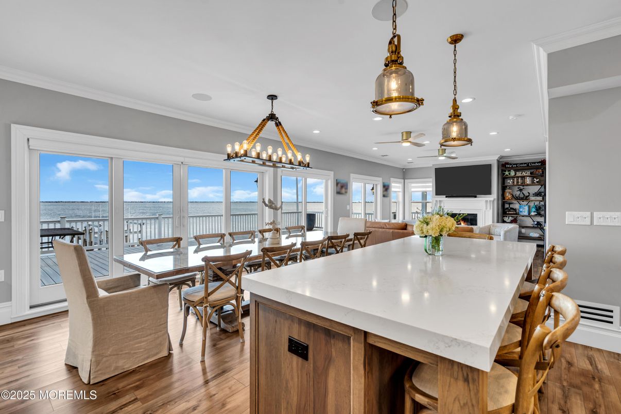 Chandelier, Dining room, Fireplace, Interior, Kitchen, Pendant Lights, Recessed Lighting, Water, Wood Texture Flooring