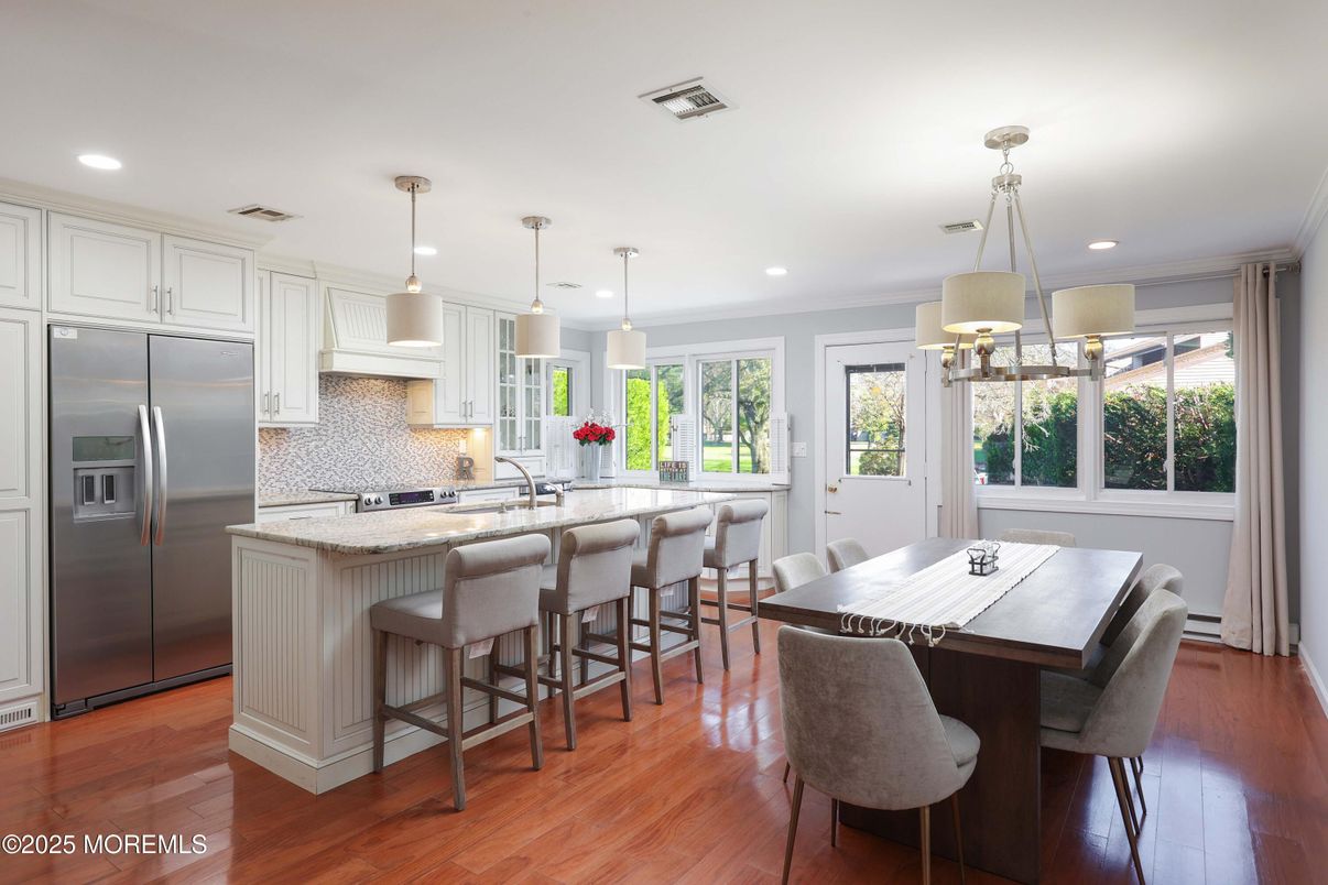 Dining room, Interior, Kitchen, Pendant Lights, Recessed Lighting, Stainless Steel Appliances, Wood Texture Flooring