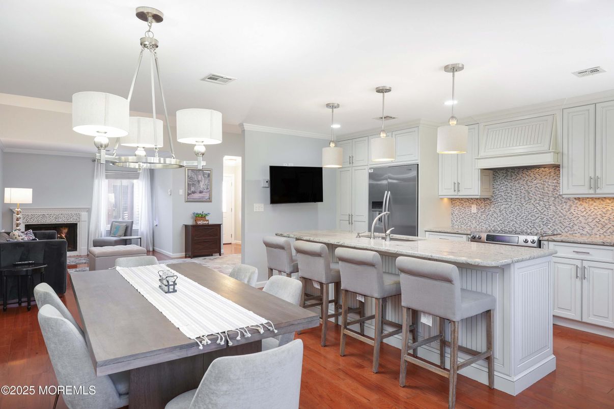 Chandelier, Dining room, Fireplace, Interior, Kitchen, Living room, Pendant Lights, Wood Texture Flooring