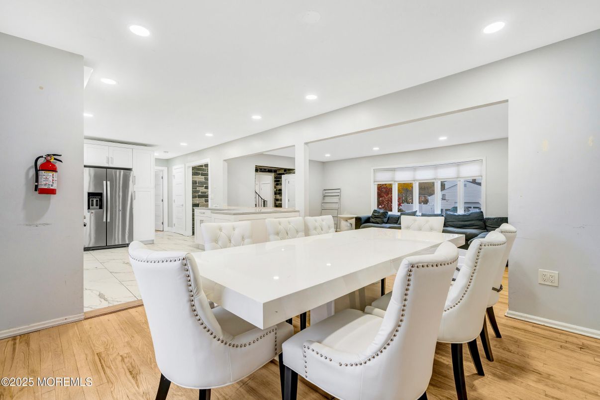 Dining room, Interior, Kitchen, Marble, Recessed Lighting, Stainless Steel Appliances, Wood Texture Flooring