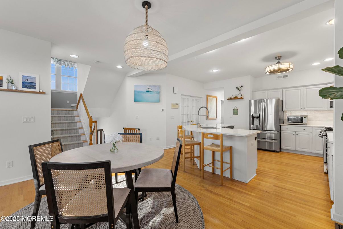 Dining room, Interior, Kitchen, Pendant Lights, Recessed Lighting, Stainless Steel Appliances, Wood Texture Flooring