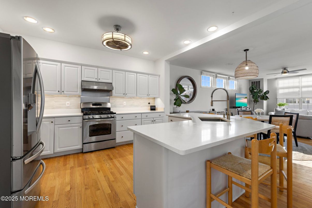 Dining room, Interior, Kitchen, Pendant Lights, Recessed Lighting, Stainless Steel Appliances, Wood Texture Flooring