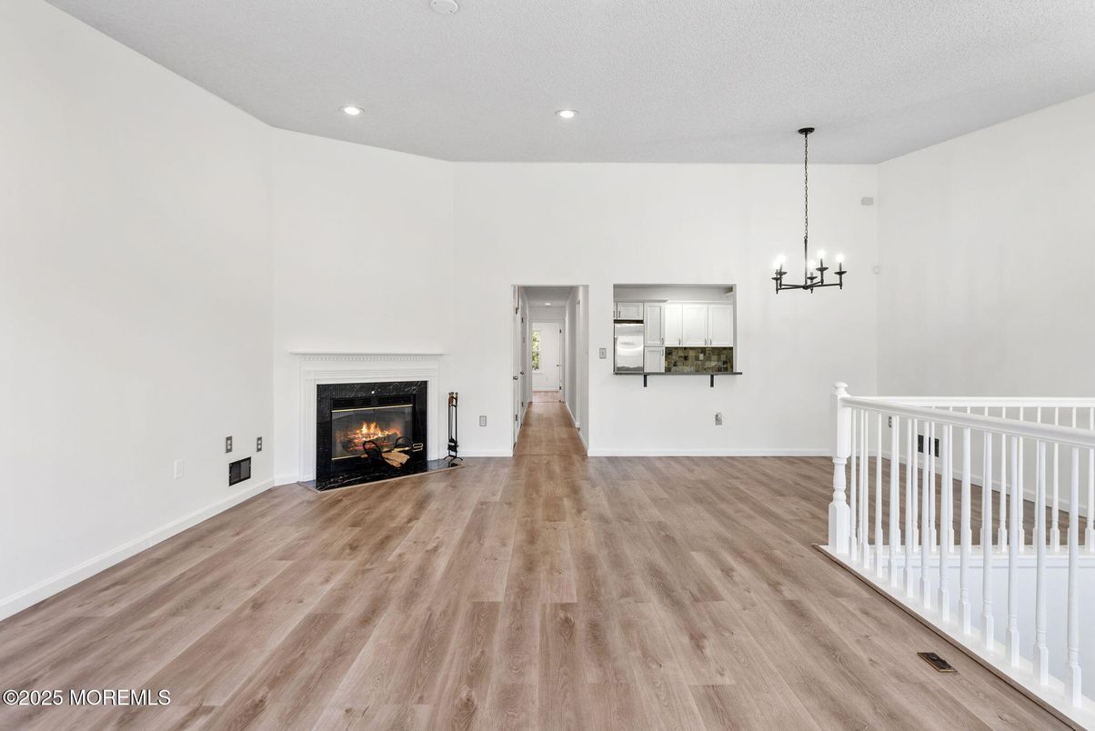 Empty room, Fireplace, Interior, Pendant Lights, Recessed Lighting, Wood Texture Flooring