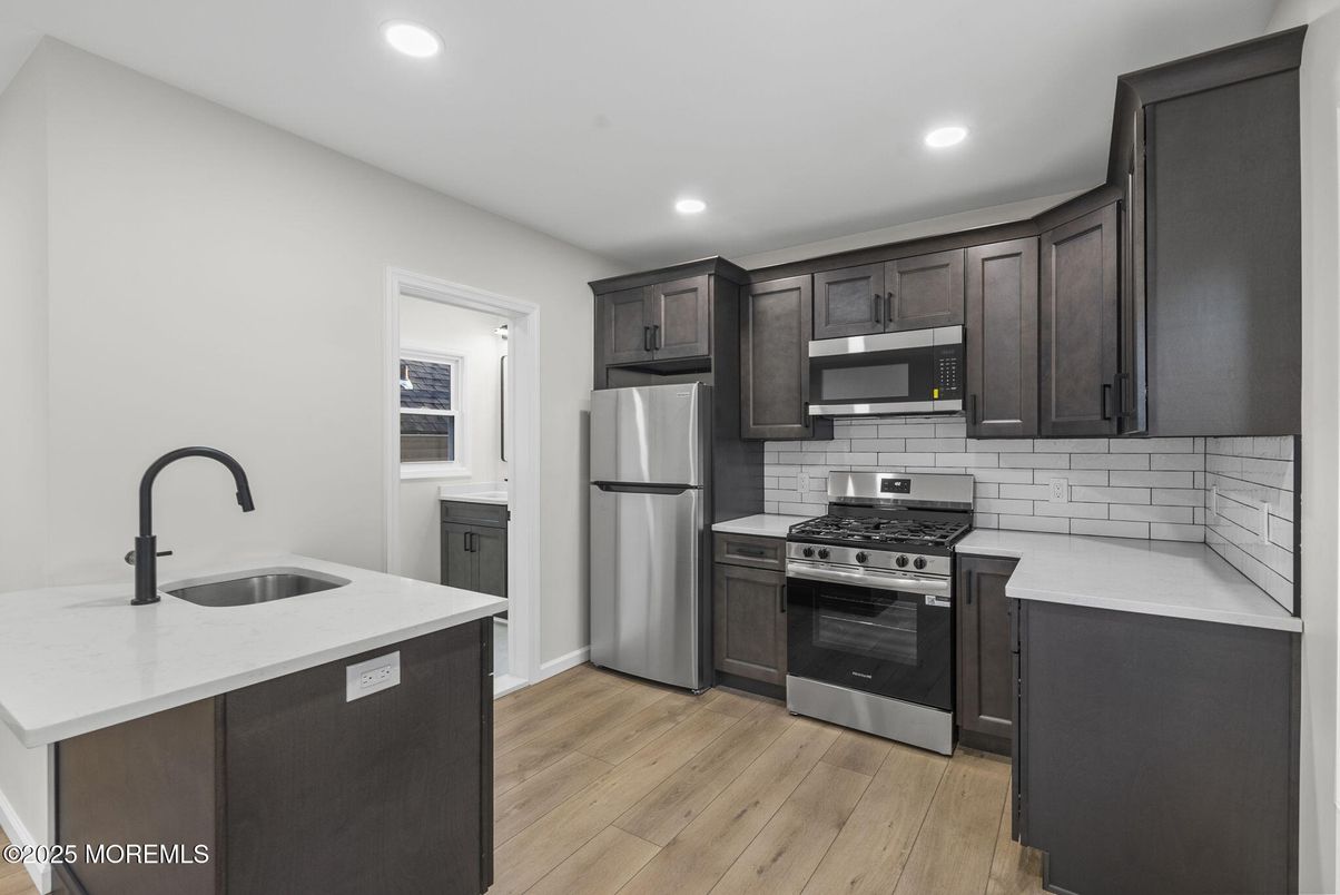 Interior, Kitchen, Recessed Lighting, Stainless Steel Appliances, Wood Texture Flooring