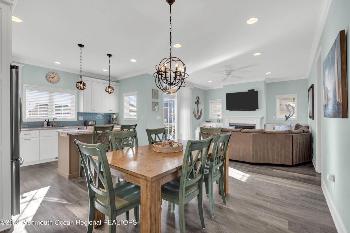 Chandelier, Dining room, Fireplace, Interior, Kitchen, Living room, Pendant Lights, Recessed Lighting, Wood Texture Flooring