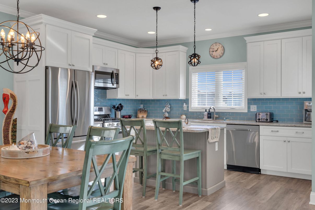 Dining room, Interior, Kitchen, Pendant Lights, Recessed Lighting, Stainless Steel Appliances, Wood Texture Flooring