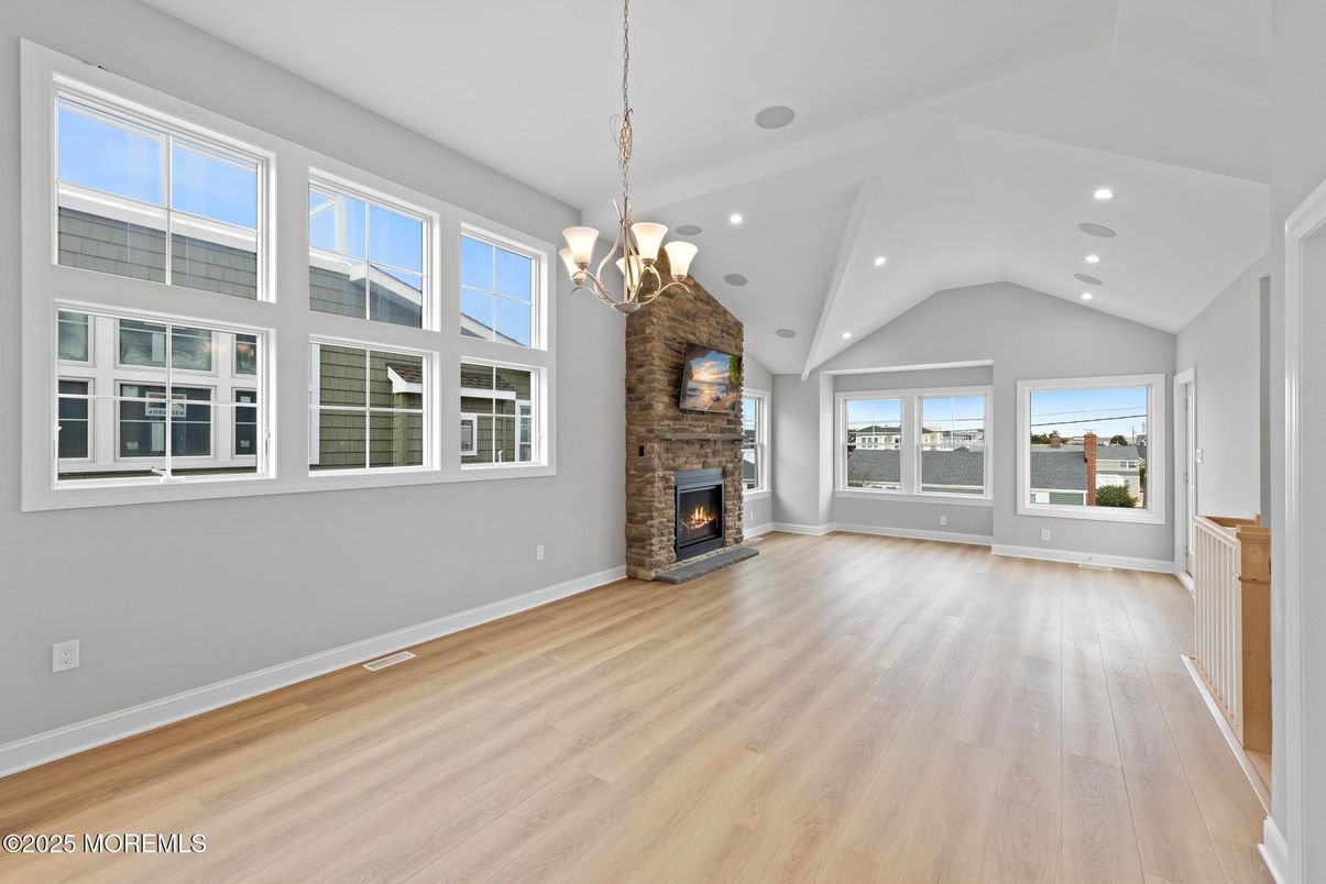 Chandelier, Empty room, Fireplace, Interior, Recessed Lighting, Wood Texture Flooring