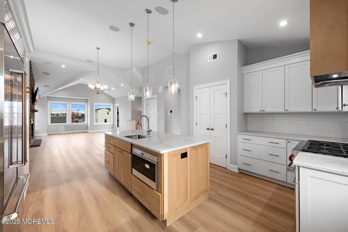 Chandelier, Interior, Kitchen, Pendant Lights, Recessed Lighting, Stainless Steel Appliances, Wood Texture Flooring