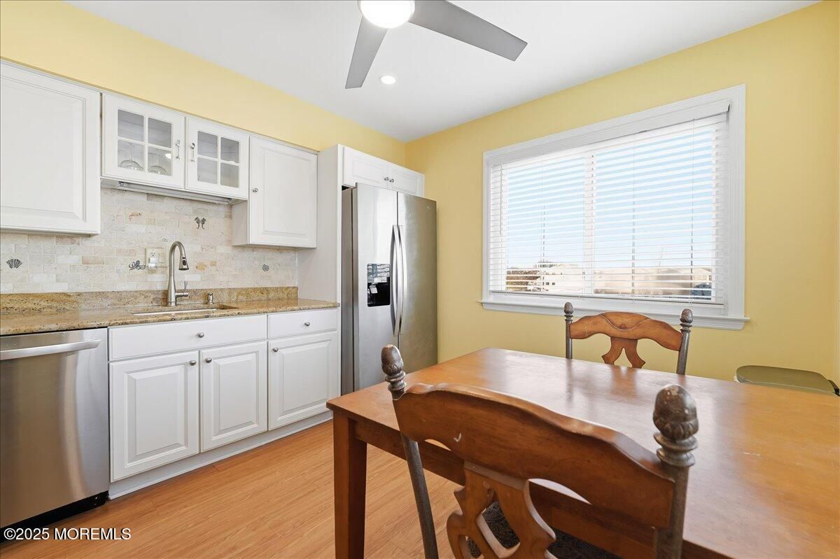 Dining room, Interior, Kitchen, Recessed Lighting, Stainless Steel Appliances, Wood Texture Flooring