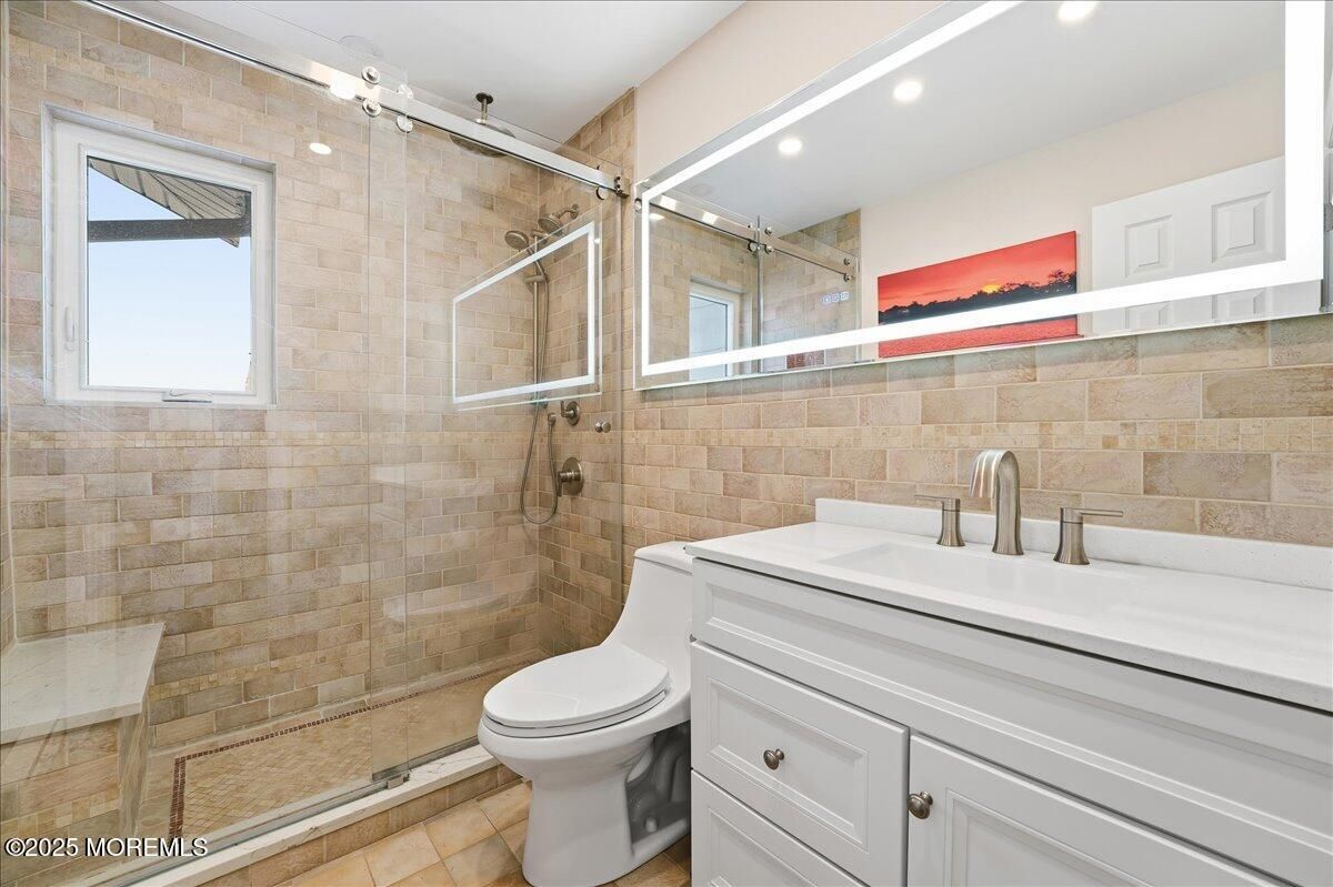 Bathroom, Glass Shower, Interior, Recessed Lighting, Stone Walls