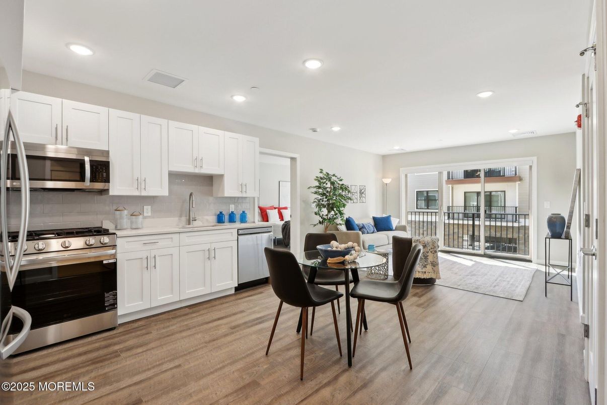 Dining room, Interior, Kitchen, Living room, Recessed Lighting, Stainless Steel Appliances, Wood Texture Flooring